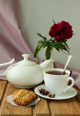Still life with  oatmeal cookies and tea service.
