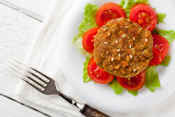 Vegetarian Lentil Burger with Tomatoes and Cabbage