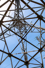 Upward view of the structure under power transmission tower