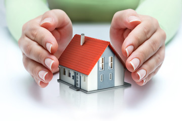 protect and insurance real estate concept  - home covered