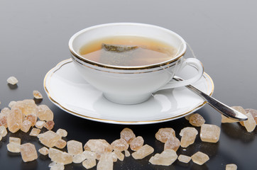 A cup of tea with sugar