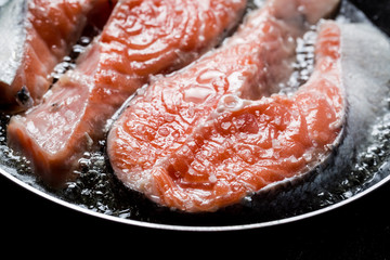 Fresh salmon fried in the pan