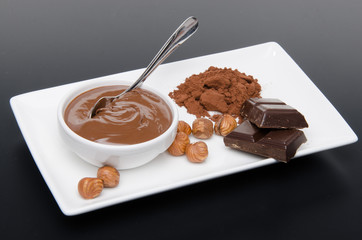 Composition of chocolate hazelnut spread, hazelnuts, chocolate a