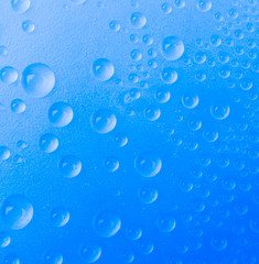 Water drop on color background