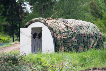 military building in wood camouflage © irontrybex