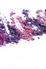 Colored eye shadow on white background
