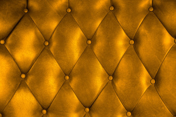 Luxury upholstery leather button chair texture in gold