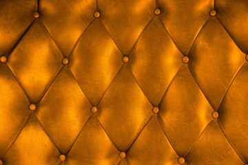 Luxury upholstery leather button chair texture in orange
