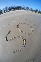 Drawings on sea sand