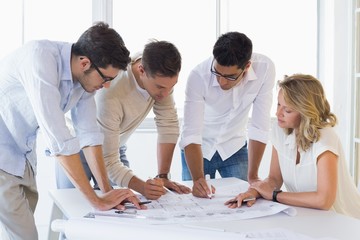 Fototapeta premium Casual architecture team working together at desk