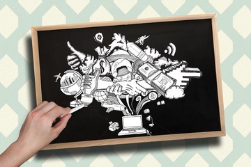Composite image of hand drawing computing graphic with chalk