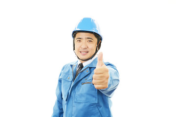ガッツポーズの作業員