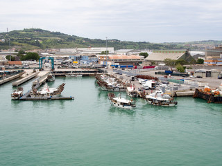 Fototapeta na wymiar Small fishing boats returning to their harbor