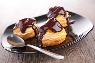 french pastry with cream and chocolate sauce
