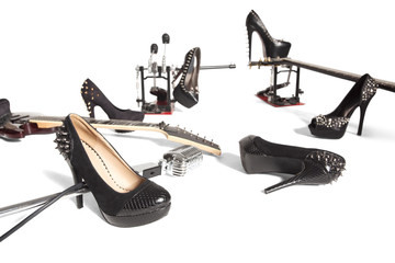 Female shoe and musical instruments scattered