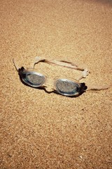 Fototapeta na wymiar blue swimmer glasses on the beach