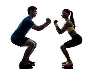 woman exercising fitness workout with man coach silhouette