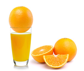 Fresh orange and glass with juice
