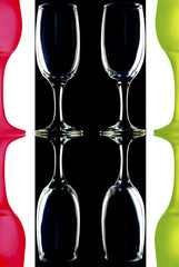 glass wine glasses on black and white background with reflection