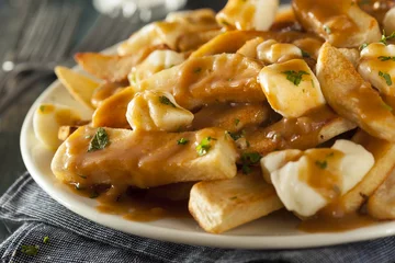 Tuinposter Unhealthy Delicious Poutine with French Fries © Brent Hofacker