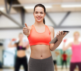 sporty woman with tablet pc computer