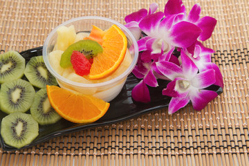 Fruit cocktail with orchid