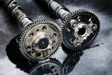 cam shaft of a turbo diesel engine on a dark background