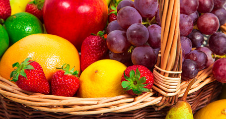 Variety of fresh fruits in wicker basket