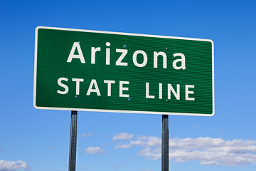 A Green Arizona State Line Road Sign
