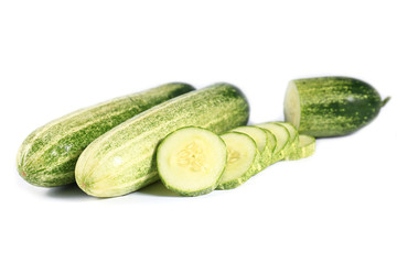 Cucumber and slices isolated over white background