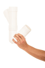 hands with plumbing tubes