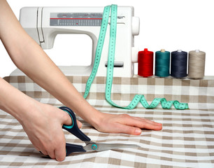 Concept of sewing. Cutting fabric. Fabric cutting scissors.