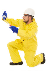 man with screwdriver protective suit