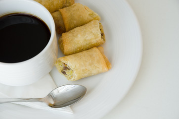 Spring roll and cup of coffee.