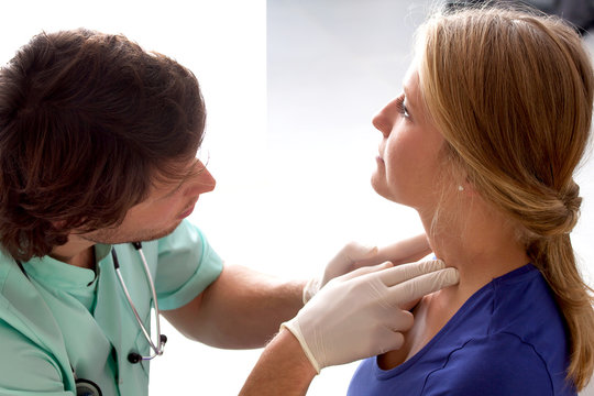 Doctor checking lymph nodes