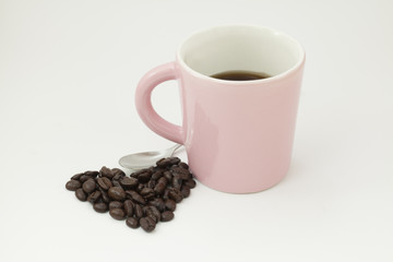 Coffee beans and a cup of coffee