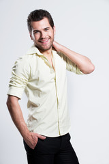 Portrait of happy man in yellow shirt.