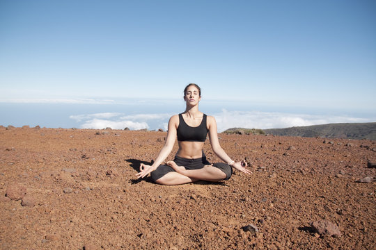 Young woman meditating in the nature