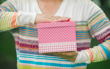 Male hands holding and giving gift