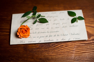 Romantic love letter and rose. Valentine’s day background.