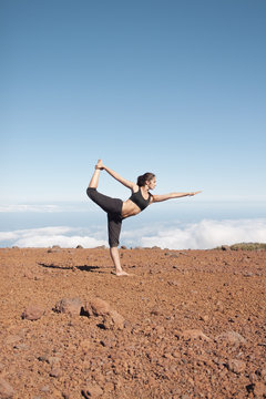 Young woman doing yoga in the nature