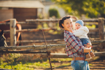 Woman with her baby on nature outdoor