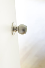 Close up - White Half-open door into room