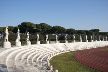 Fototapeta premium Marble statues in the Stadio dei Marmi, Rome Italy.