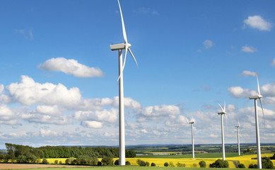 Wind turbines and cloudy blue sky