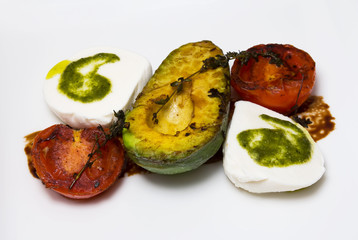 Grilled avocados, tomatoes and feta cheese