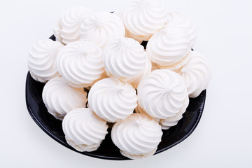 French vanilla meringue cookies on white background