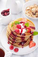 pancakes with berry and jam for breakfast