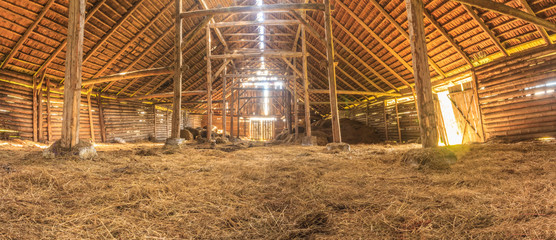 Panorama interior of old farm barn with straw - obrazy, fototapety, plakaty