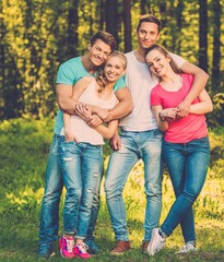 Group of happy friends outdoors on sunny day